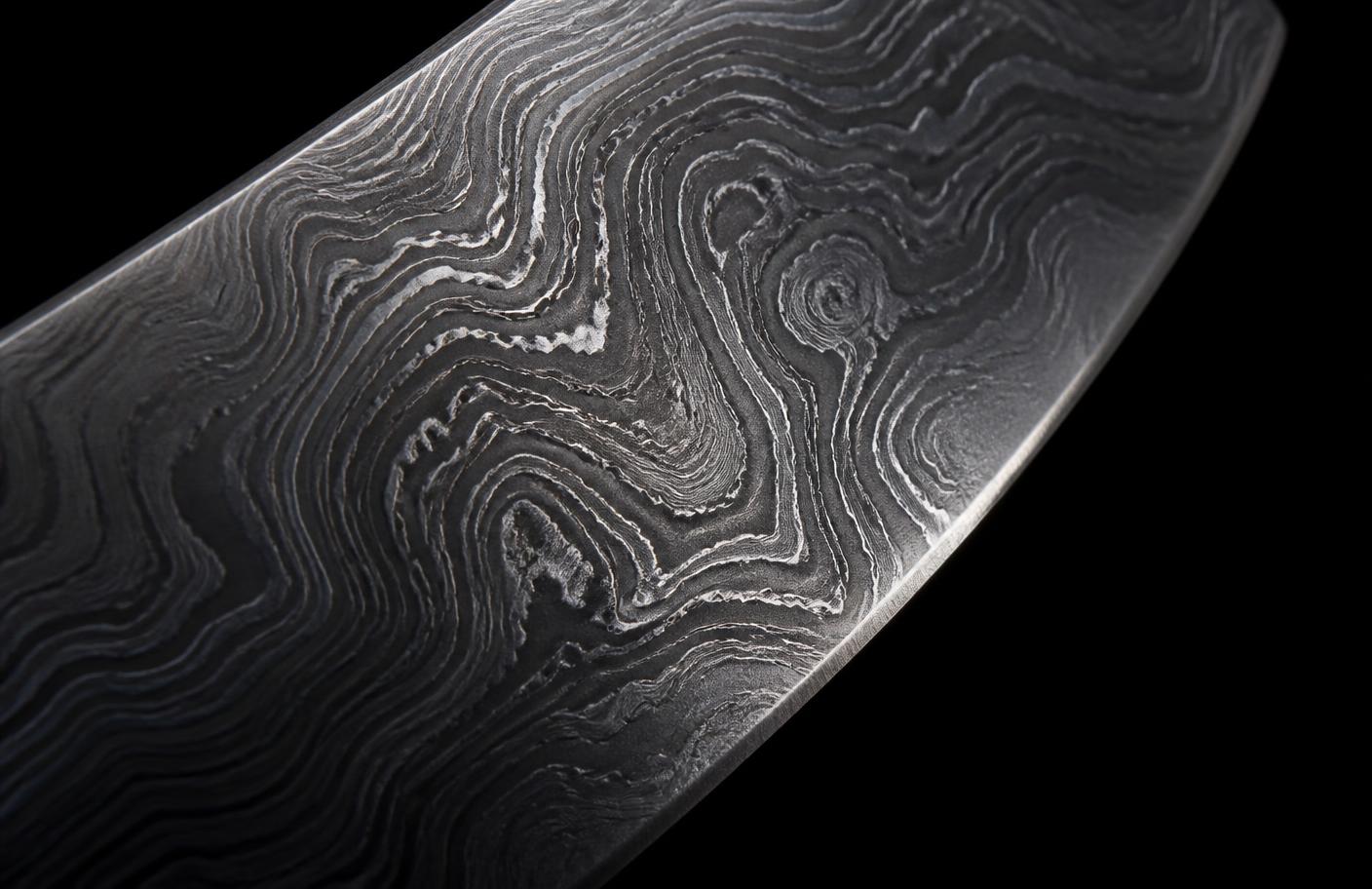 Macro detail of layered Damascus steel pattern